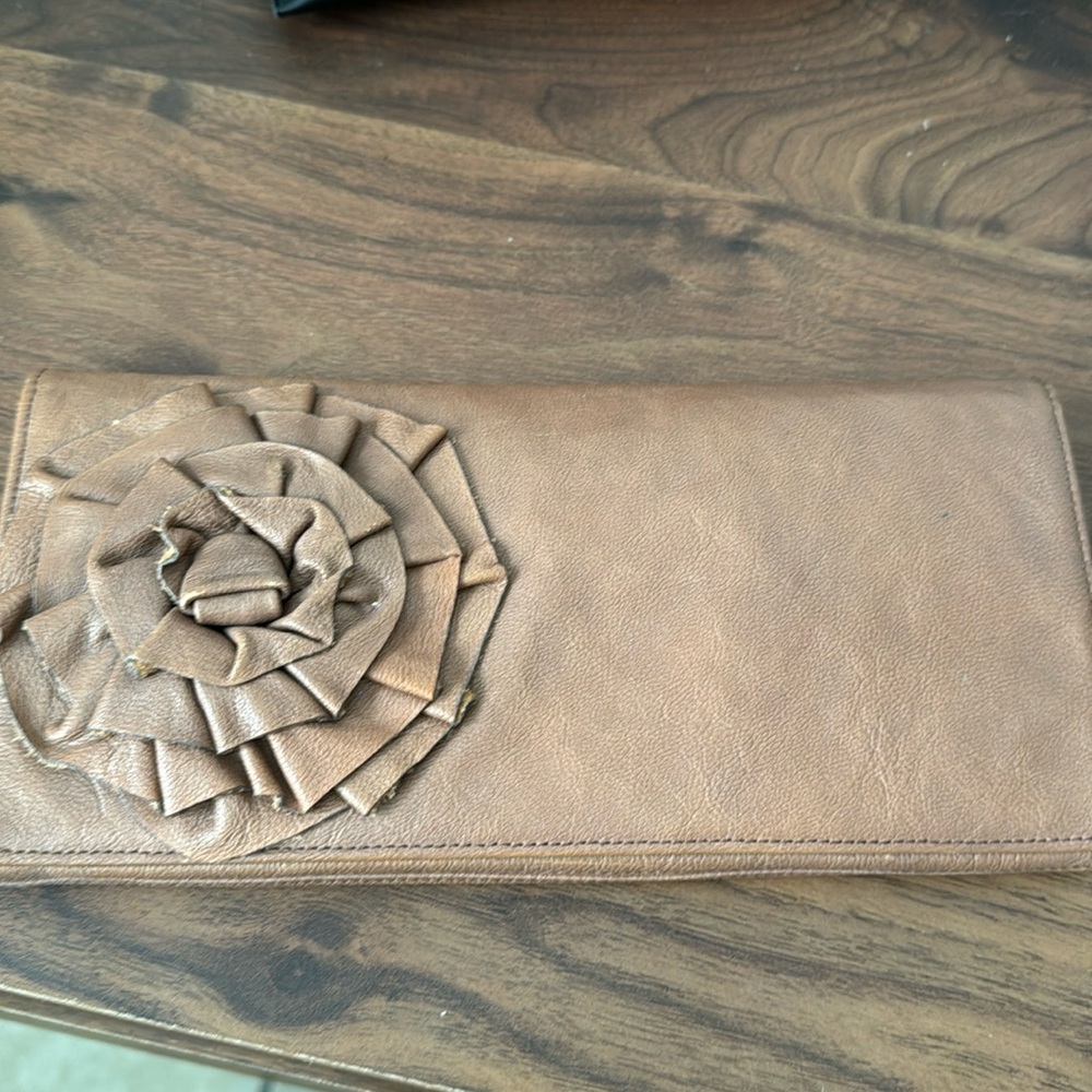 Leather clutch with flower detail
